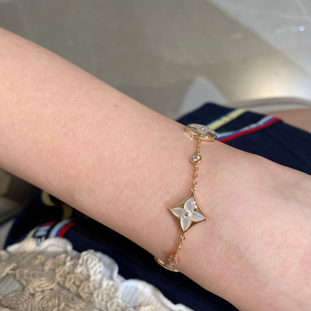 [Luxery]STAR AND SUN 4 MOTIF WHITE MOP PINK GOLD BRACELET